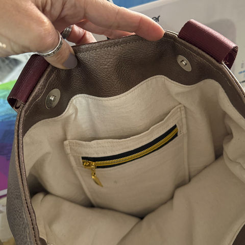 bolsillo doble con cierre para colocar en bolsos