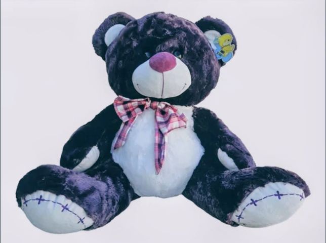 Oso de peluche Gigante con moño. En color Gris ( de 1.20 m. Sentado)