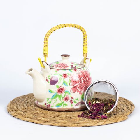Tetera con flores rosadas